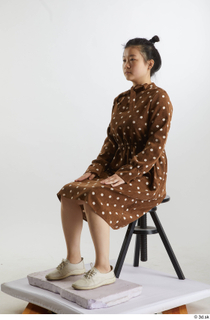 Aera  1 brown dots dress casual dressed sitting white…